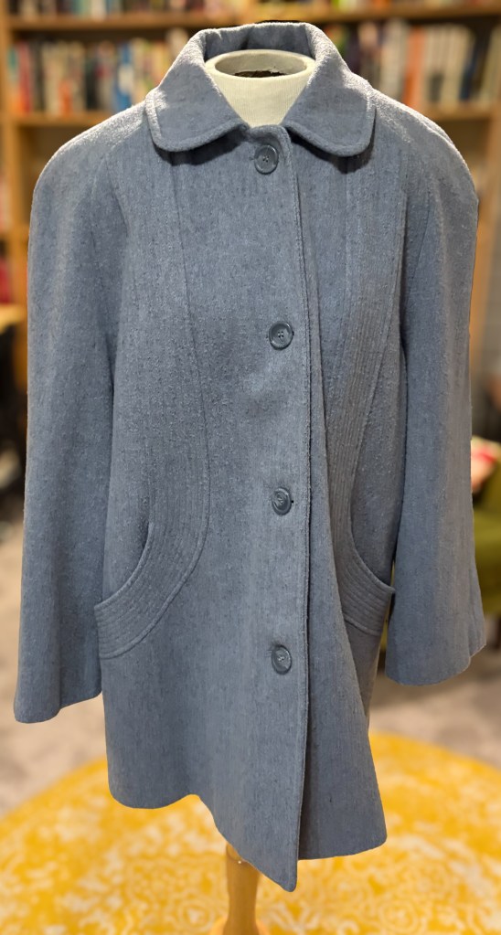 A bluish-grey wool coat. 