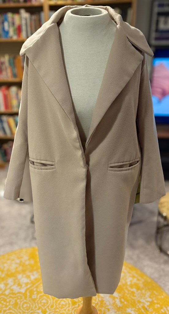 A beige trench coat. 