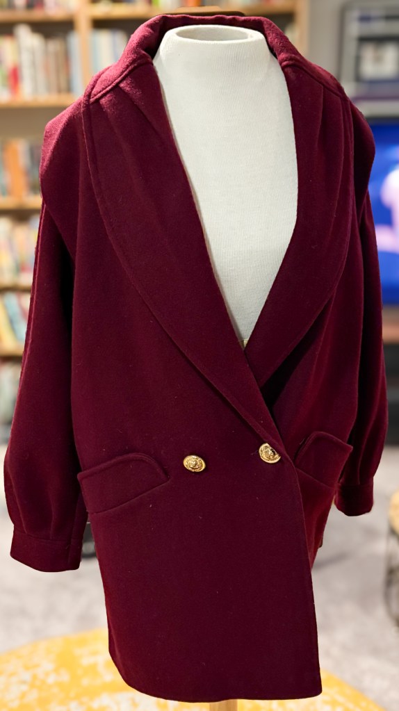 A plum-colored vintage overcoat. 