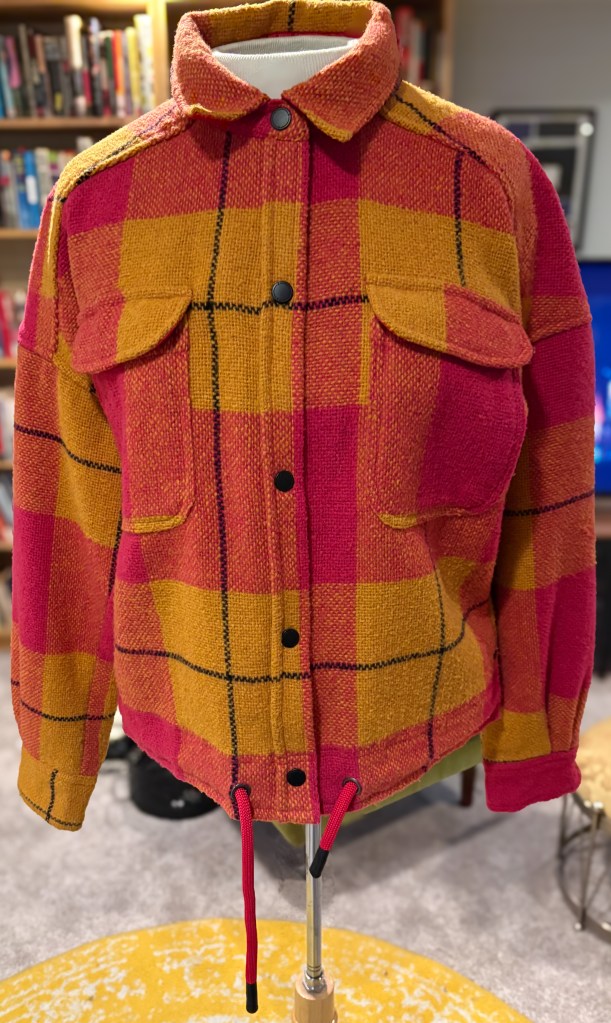 A pink and yellow checked jacket. 