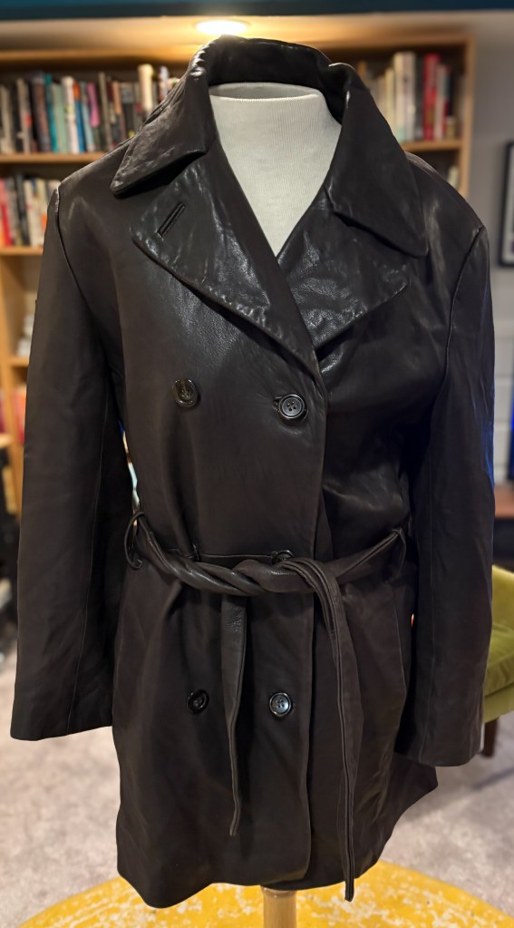A brown leather trench coat. 