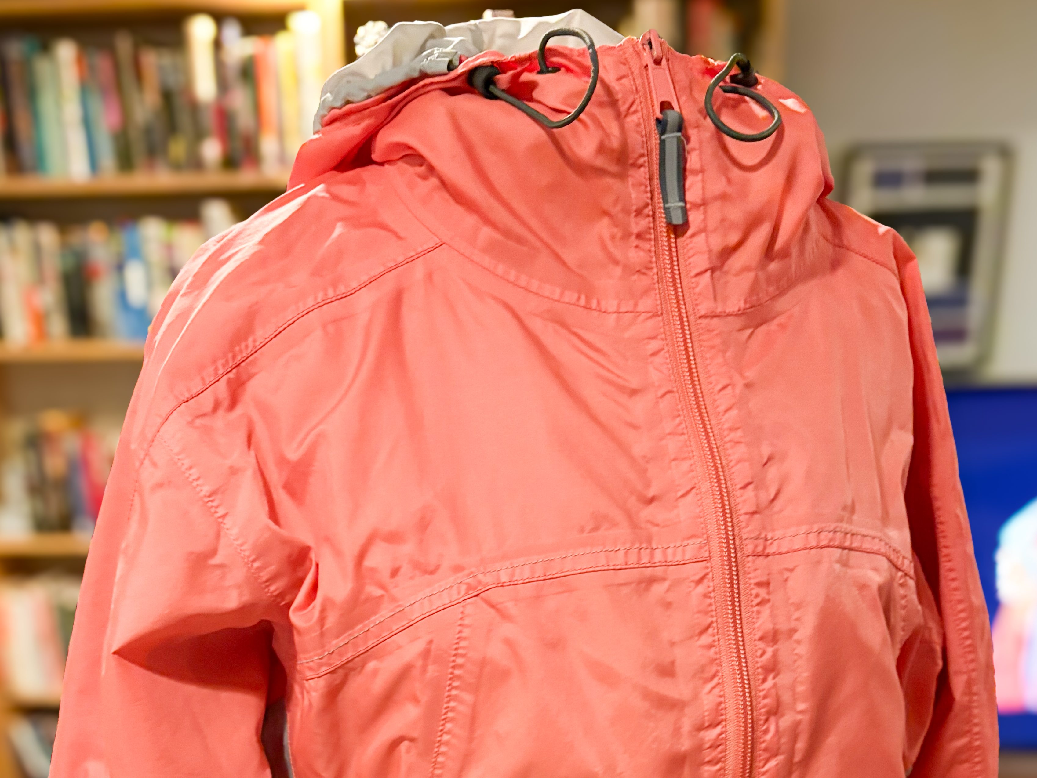 A pink nylon jacket. 